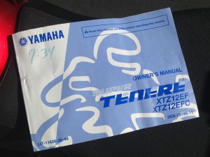 The owner's manual for our Yamaha Super Tenere test bike is stored under the seat.
