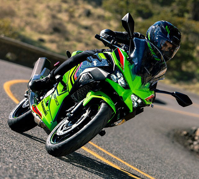 green Kawasaki ninja 500 outdoor cornering shot