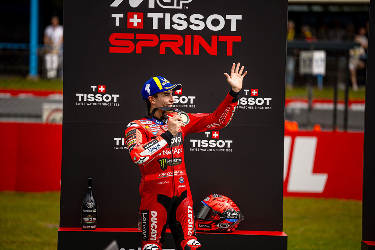 Marc Márquez celebrates Sprint Race victory at Assen, holding winner’s medal.