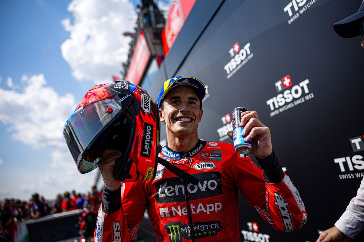 Marc Márquez holding his helmet after winning the MotoGP race at Brno.