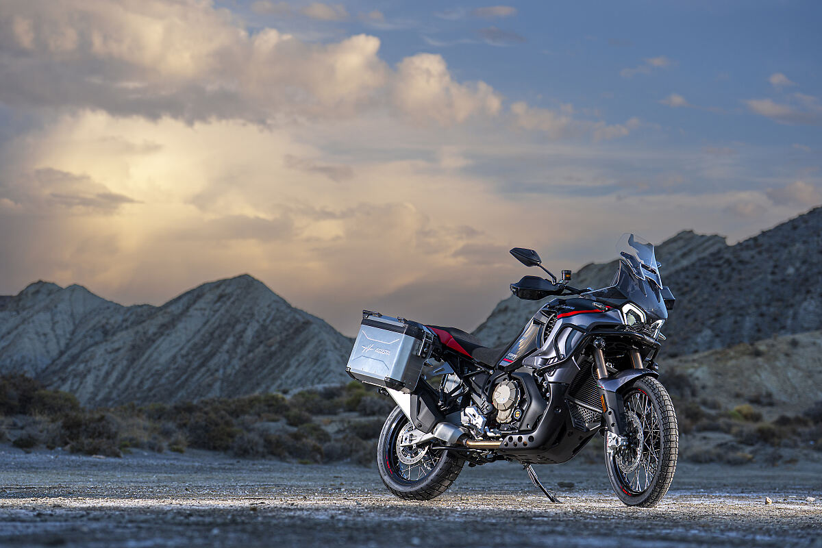 MV Agusta Enduro Veloce travel enduro motorcycle on mountain background at dusk